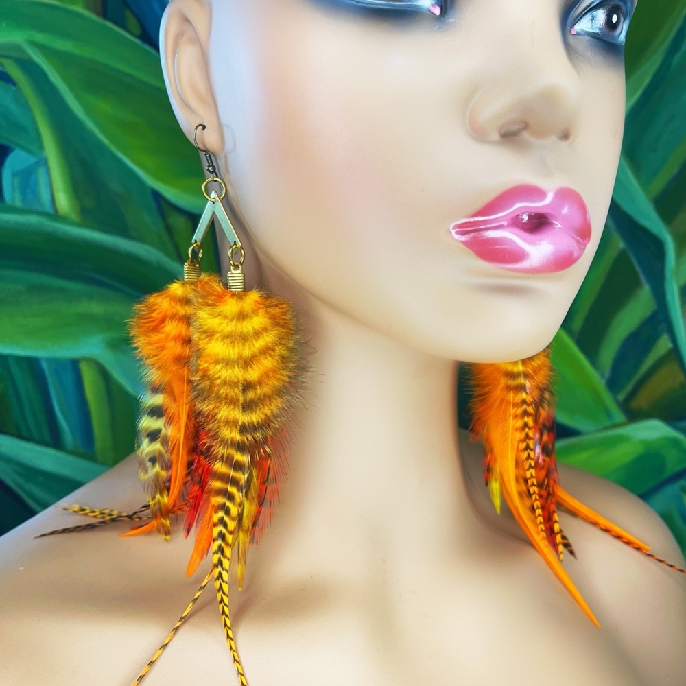 Long orange feather earrings with gold pendants